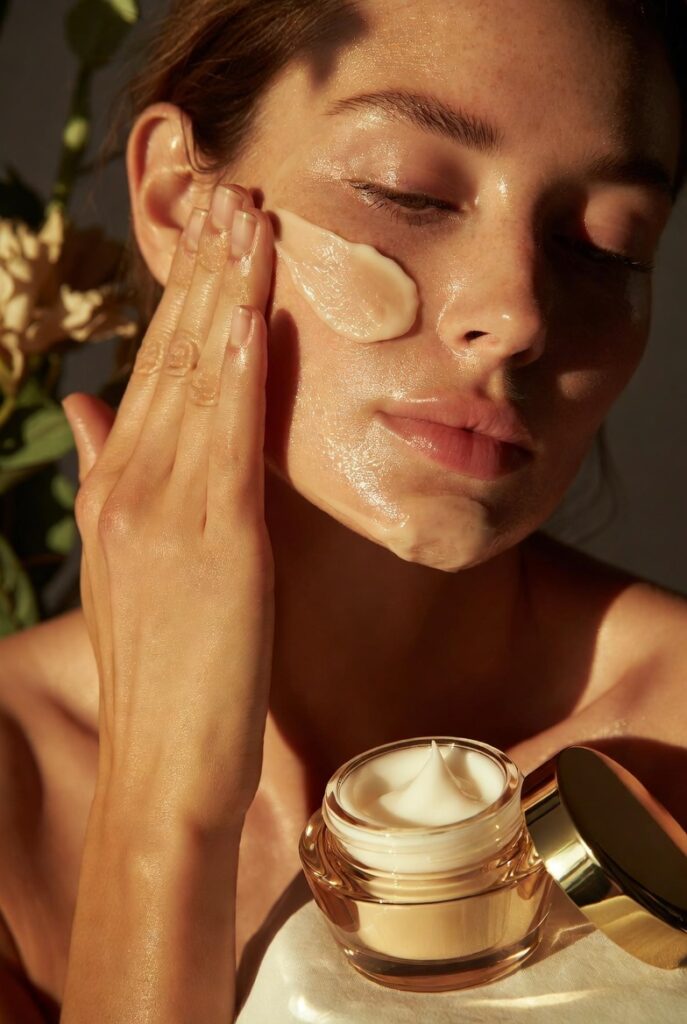 A glowing woman with dewy glass-like Korean skin surrounded by elegant skincare products including toners, serums, and botanicals, representing 20 Korean skin care ideas for a naturally radiant complexion.
