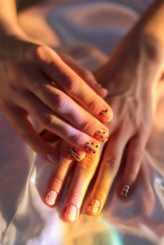 "23 simple nail design ideas showing easy DIY manicure styles including french fade, ombré, marble swirl, and glitter accents for beautiful everyday nails."