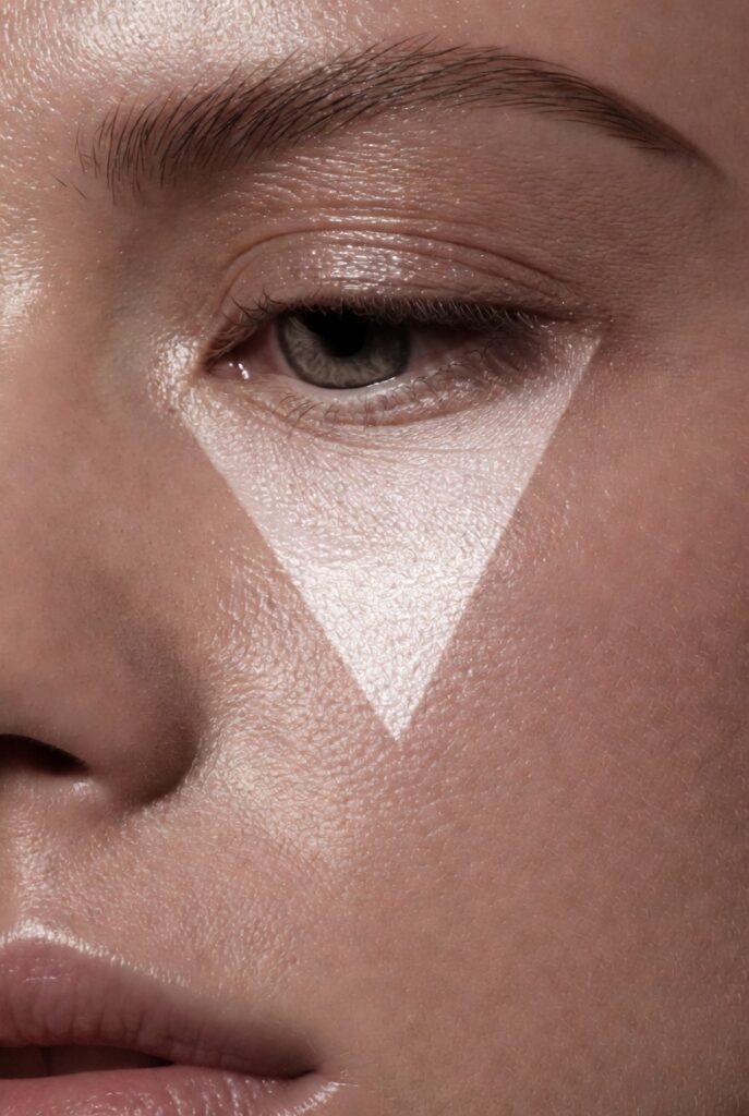 3. Highlighter in a Tight Triangle Under the Eyes